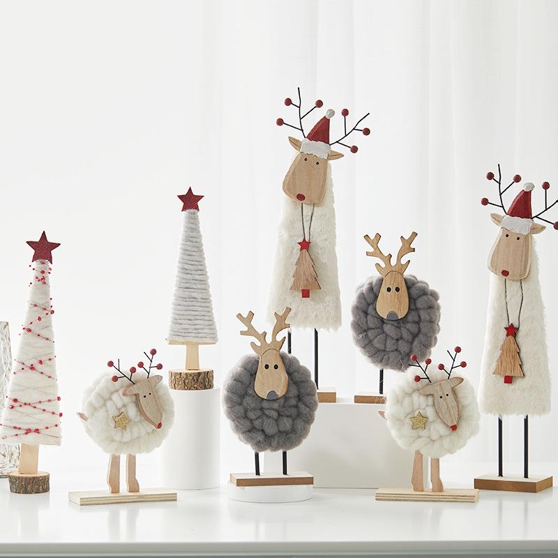 Đồ trang trí Giáng Sinh phong cách Bắc Âu - gỗ và len, bao gồm tuần lộc, ông già Noel, cây thông. Hoàn hảo cho trang trí bàn và không gian Giáng Sinh.