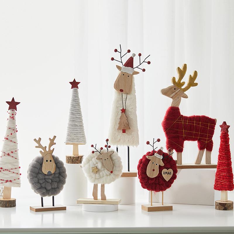 Đồ trang trí Giáng Sinh phong cách Bắc Âu - gỗ và len, bao gồm tuần lộc, ông già Noel, cây thông. Hoàn hảo cho trang trí bàn và không gian Giáng Sinh.