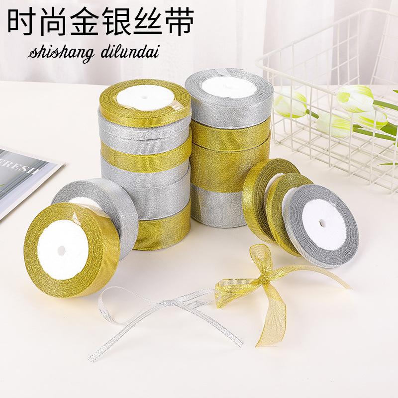 Dây kim tuyến vàng và bạc, kích thước 0.6-5cm, lý tưởng cho hộp quà trái cây và đóng gói bánh. Bán buôn và trang trí lễ hội.